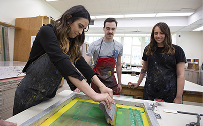 Students in a hands-on screen printing class